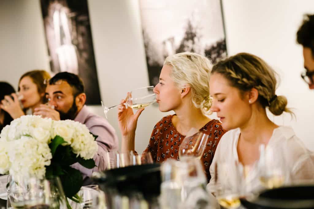 Women enjoying drinks at a gathering.
